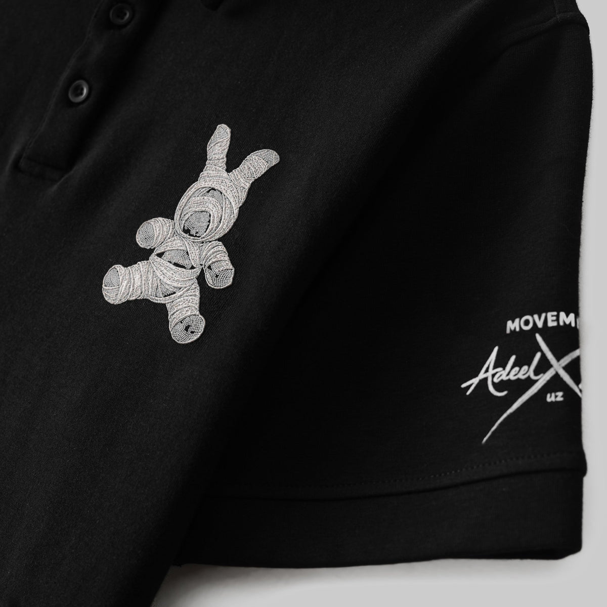 THE QUAD-BEAR GRID POLO